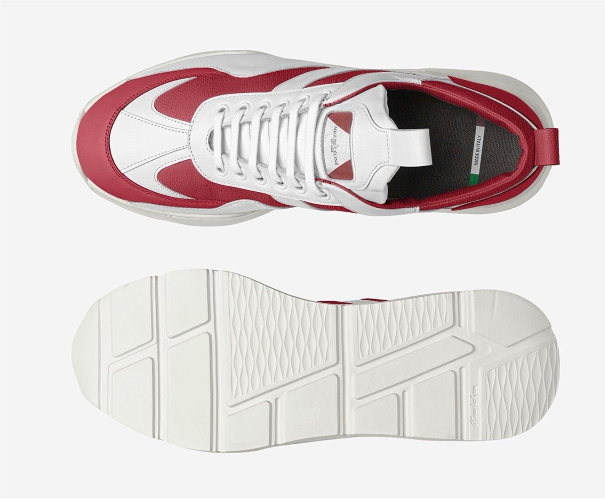 White and red sneaker with a focus on sole design on a white background