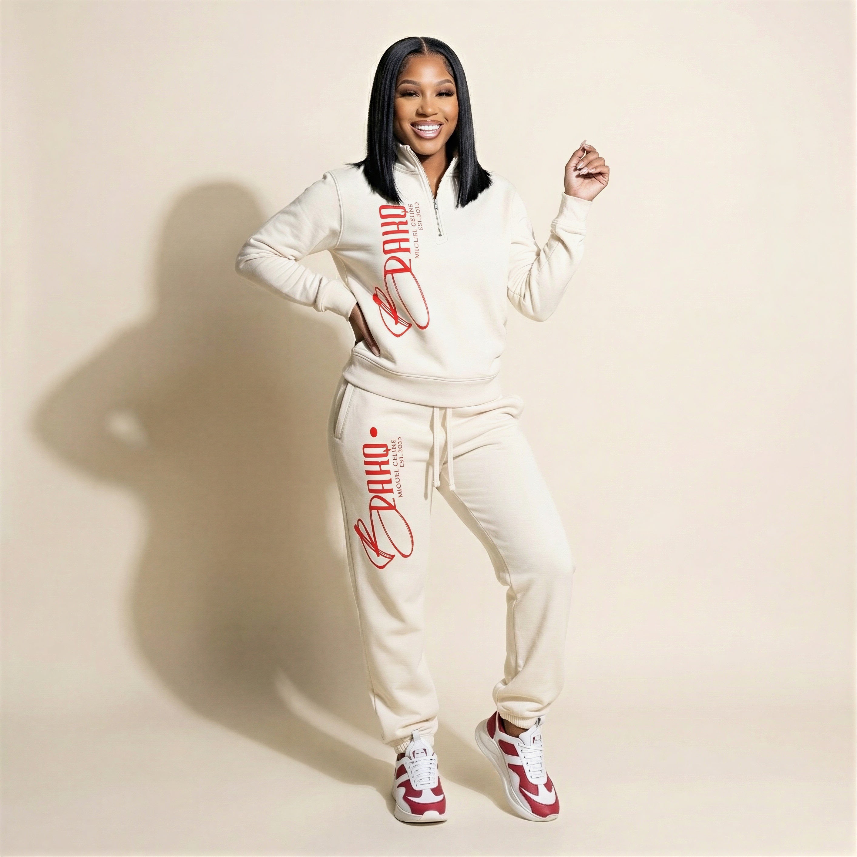 Woman wearing a white tracksuit with red text on a beige background