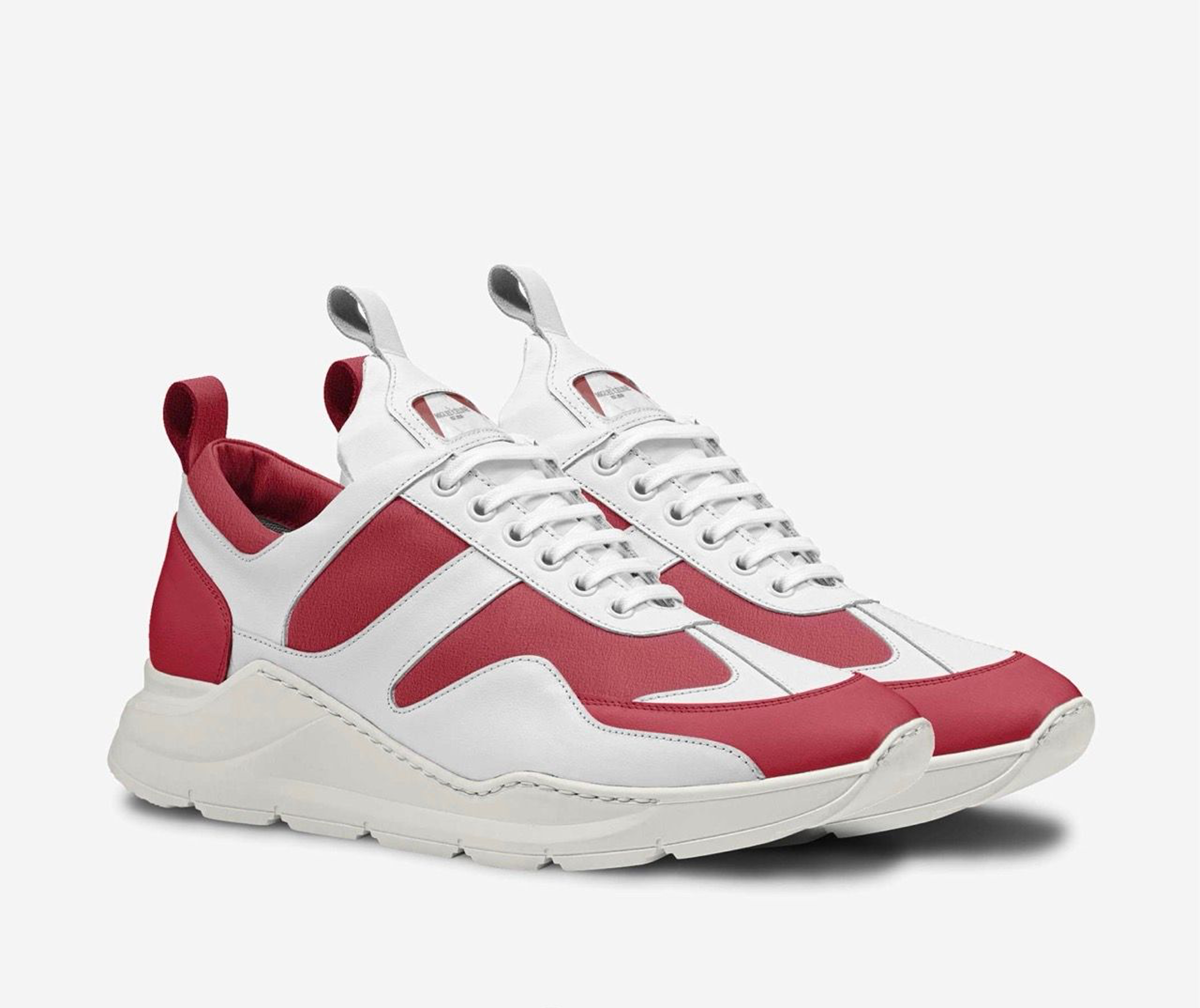 White and red sneakers on a light gray background